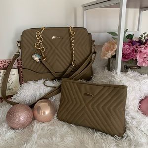 Fashionable med/Lg handbag with gold Straps and accents. Man-made leather.